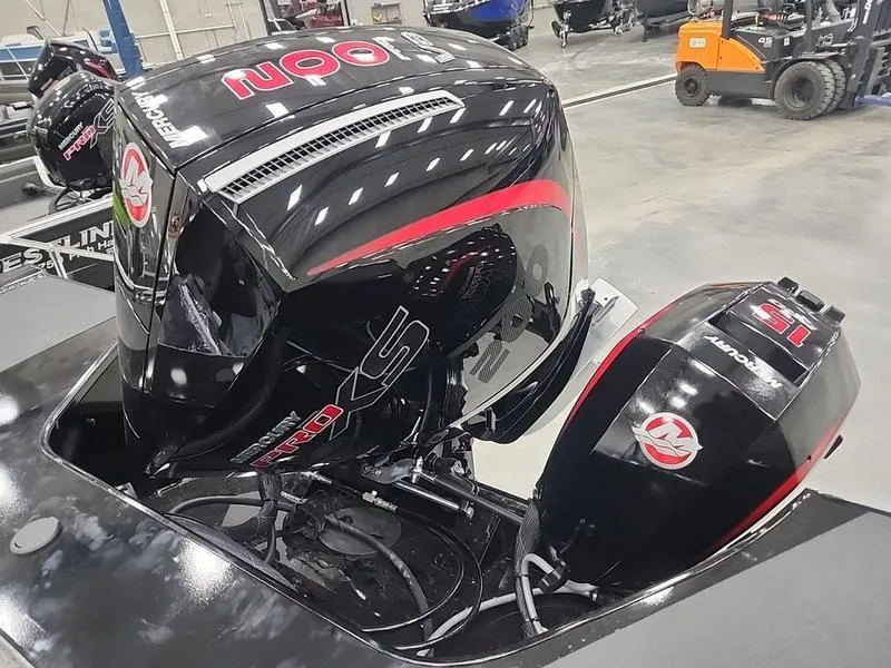 Slide: The Image of 2024 Crestliner 2050 Commander Elite with powerful Mercury outboard engines in a showroom. - 22