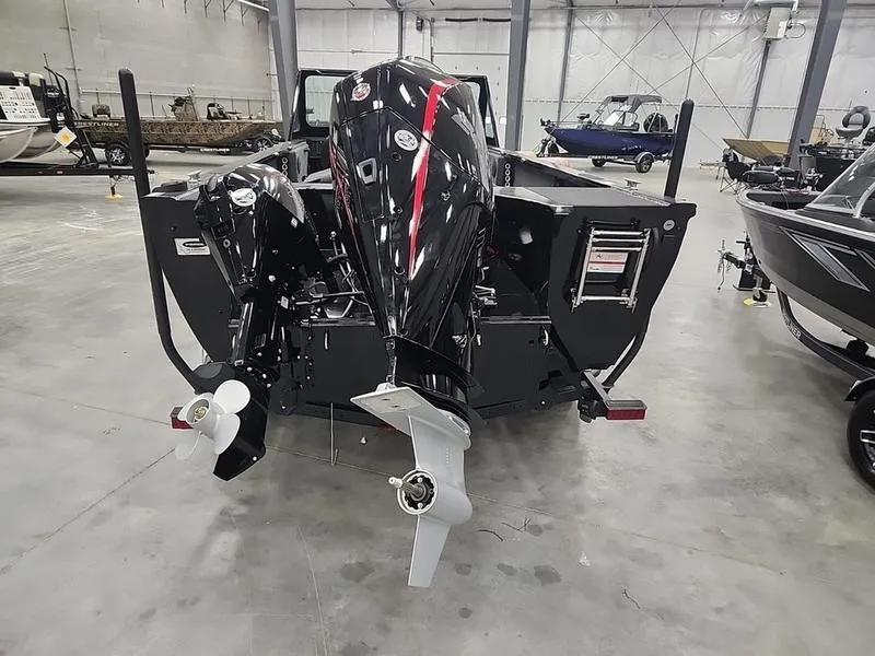 Slide: The Image of 2024 Crestliner 2050 Commander Elite boat with dual outboard motors in showroom. - 4