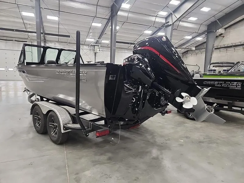 Slide: The Image of 2024 Crestliner 2050 Commander Elite boat on trailer in warehouse. - 5