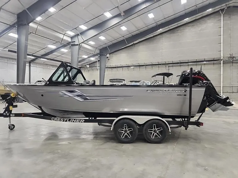 Slide: The Image of 2024 Crestliner 2050 Commander Elite boat on trailer in indoor showroom. - 6