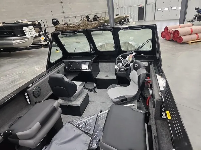 Slide: The Image of Interior of 2024 Crestliner 2050 Commander Elite boat in a showroom. - 9