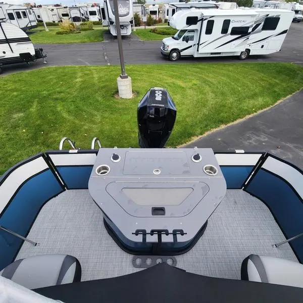 Slide: The Image of 2024 South Bay S224FCR 3.0 pontoon boat with motor, parked near RVs. - 15