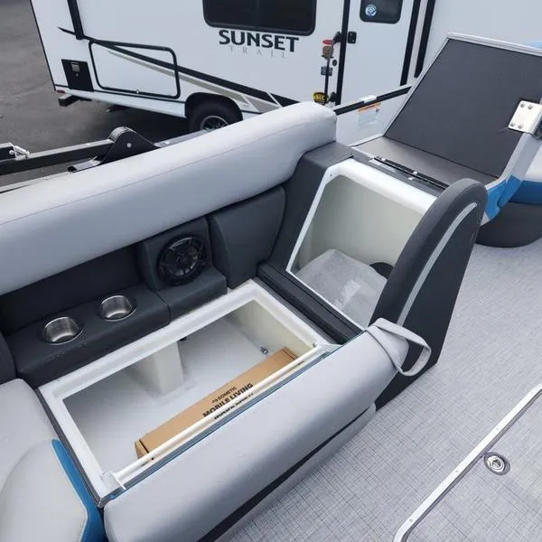 Slide: The Image of 2024 South Bay S224FCR 3.0 boat interior with storage compartments and seating. - 16