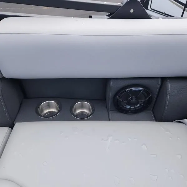 Slide: The Image of 2024 South Bay S224FCR 3.0 boat interior with cup holders and speaker. - 17