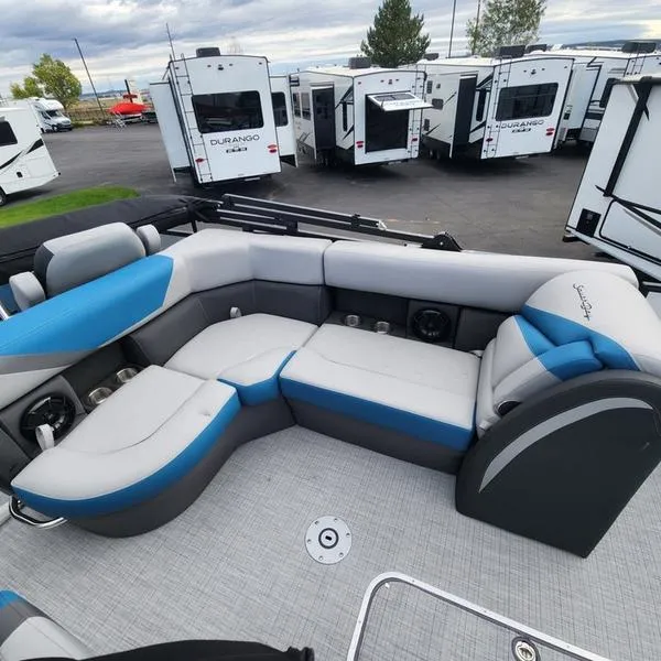 Slide: The Image of 2024 South Bay S224FCR 3.0 pontoon boat interior with blue and gray seating. - 18