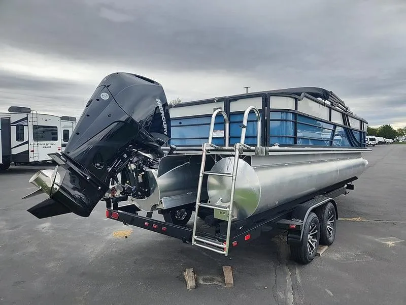 Slide: The Image of 2024 South Bay S224FCR 3.0 pontoon boat on trailer, featuring powerful outboard motor. - 3