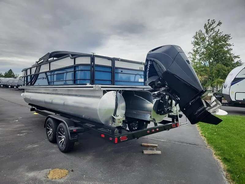 Slide: The Image of 2024 South Bay S224FCR 3.0 pontoon boat on trailer, parked outdoors. - 5
