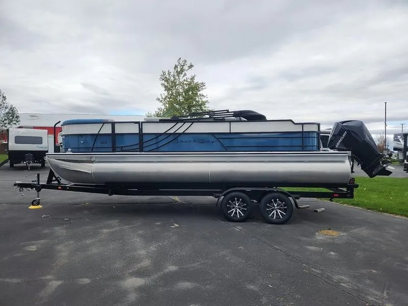 Slide: The Image of 2024 South Bay S224FCR 3.0 pontoon boat on trailer, parked outdoors. - 6