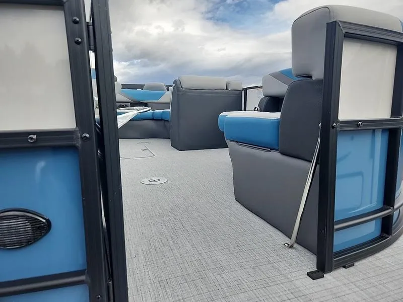 Slide: The Image of 2024 South Bay S224FCR 3.0 pontoon boat interior with blue and gray seating. - 8