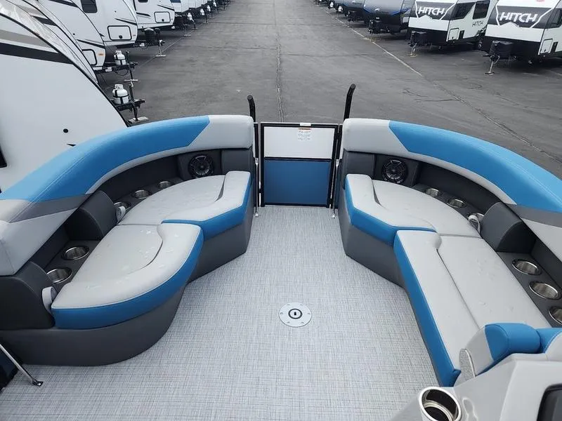 Slide: The Image of 2024 South Bay S224FCR 3.0 pontoon boat interior with blue and gray seating. - 9