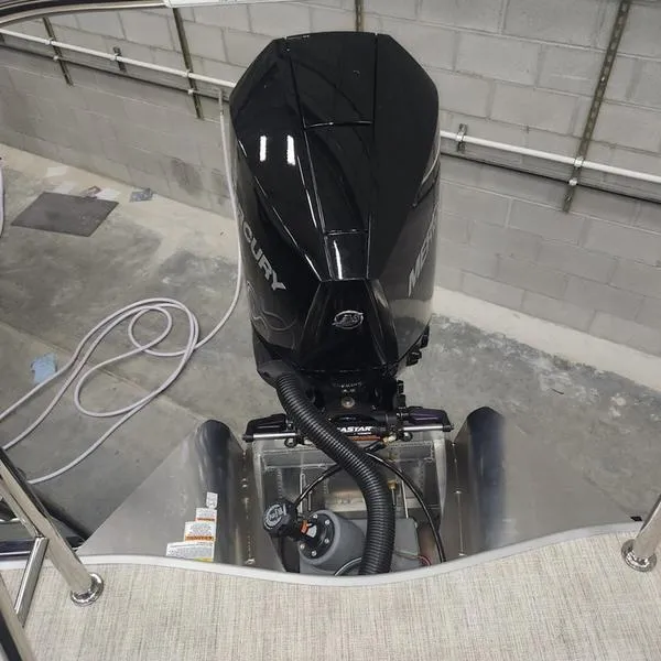 Slide: The Image of 2024 South Bay S224RS 3.0 boat engine in a garage setting. - 12