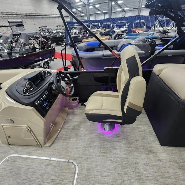 Slide: The Image of 2024 South Bay S224RS 3.0 boat interior with modern helm and seating. - 14