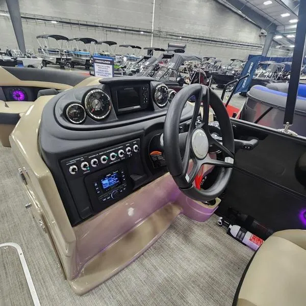 Slide: The Image of 2024 South Bay S224RS 3.0 boat dashboard with steering wheel and control panel. - 15