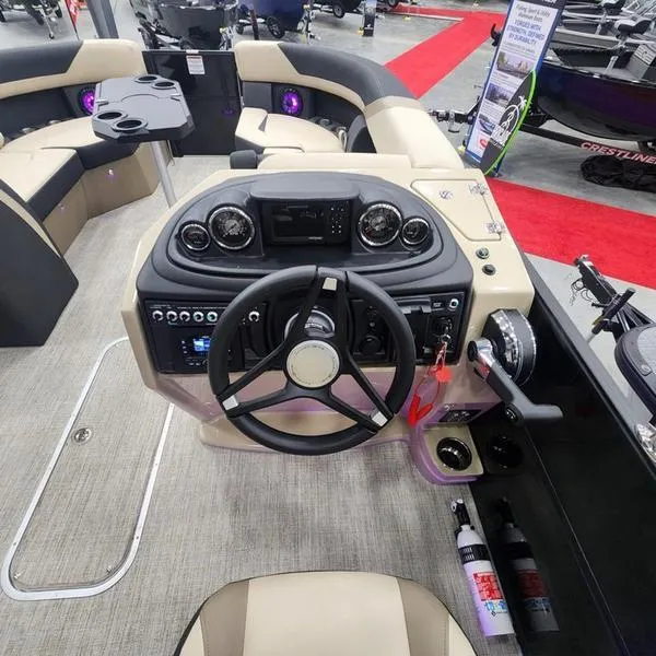 Slide: The Image of 2024 South Bay S224RS 3.0 boat interior with steering console and seating area. - 16