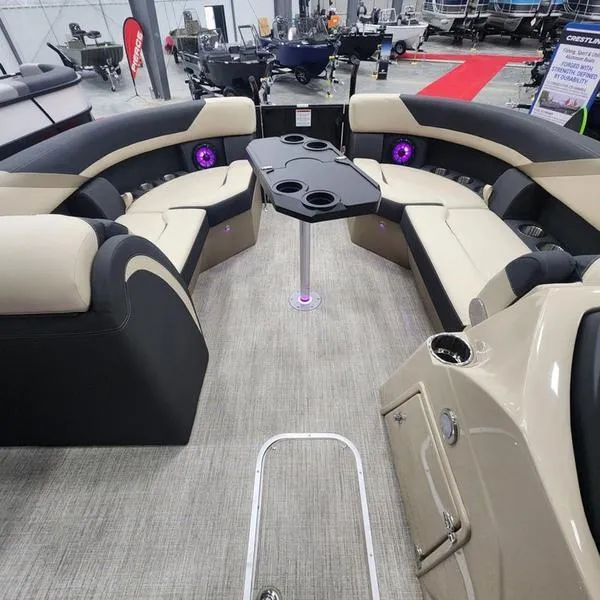 Slide: The Image of Luxurious interior of 2024 South Bay S224RS 3.0 pontoon boat with plush seating and table. - 17