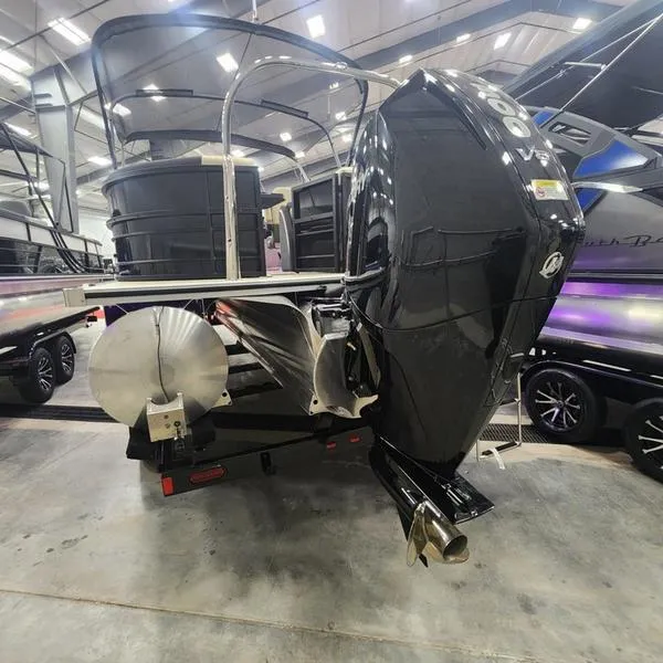 Slide: The Image of 2024 South Bay S224RS 3.0 pontoon boat with powerful outboard motor in showroom. - 21