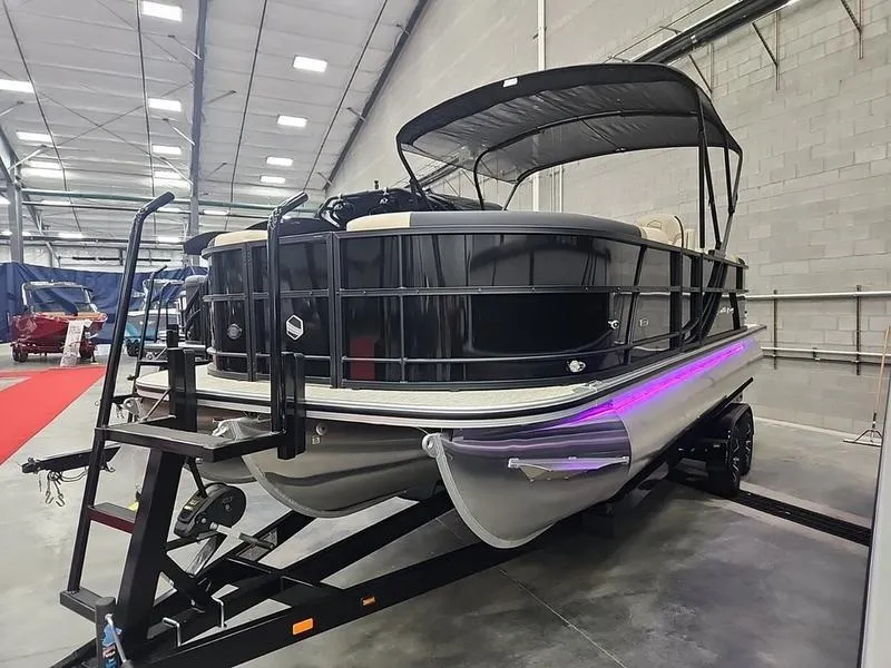 Slide: The Image of 2024 South Bay S224RS 3.0 pontoon boat on trailer in showroom. - 4