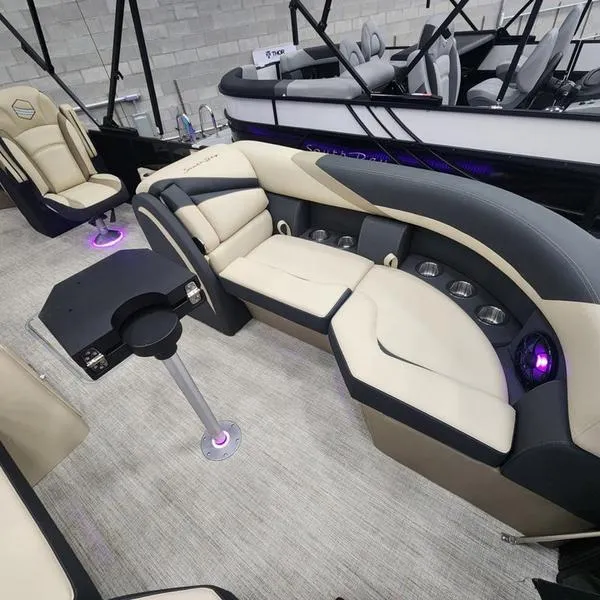 Slide: The Image of 2024 South Bay S224RS 3.0 pontoon boat interior with plush seating and modern design. - 6