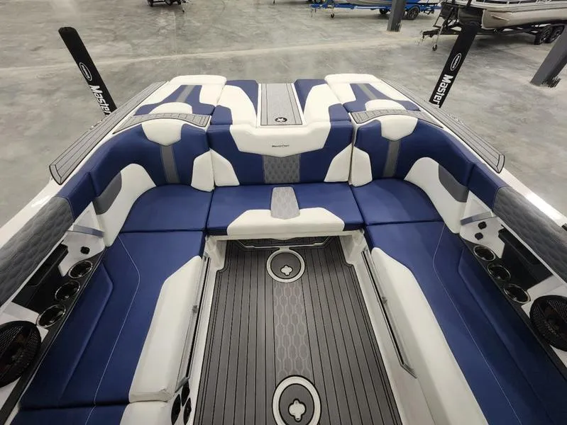 Slide: The Image of 2023 MasterCraft XT22-T interior with blue and white seating, modern design. - 10