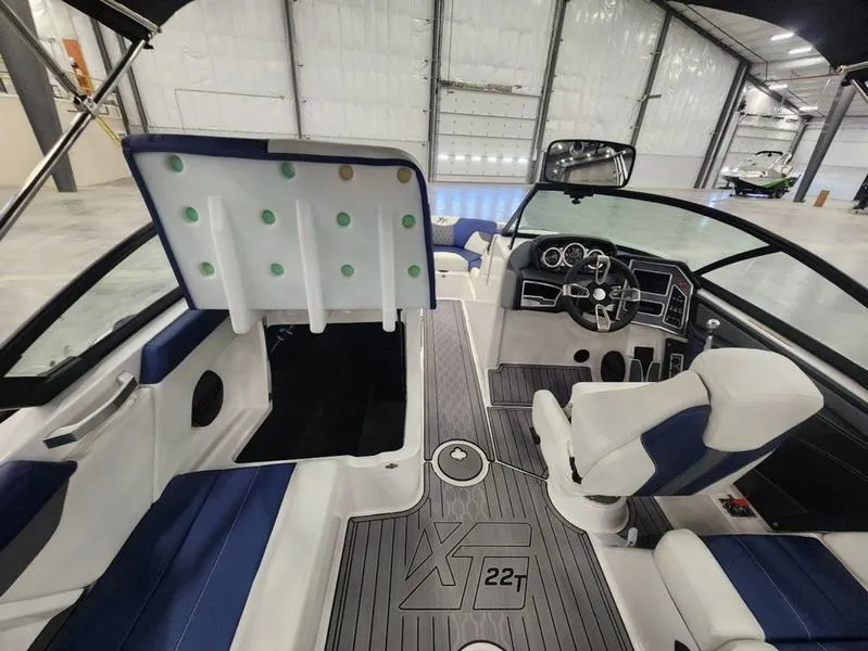 Slide: The Image of Interior of 2023 MasterCraft XT22-T boat with modern dashboard and seating. - 18