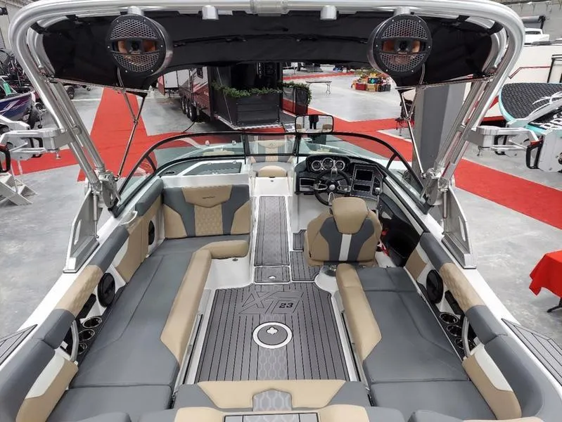 Slide: The Image of Interior of 2023 MasterCraft XT23 boat with modern seating and dashboard. - 15