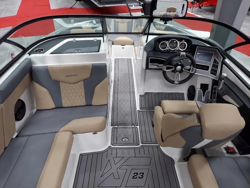 Slide: The Image of 2023 MasterCraft XT23 boat interior with modern dashboard and seating. - 16