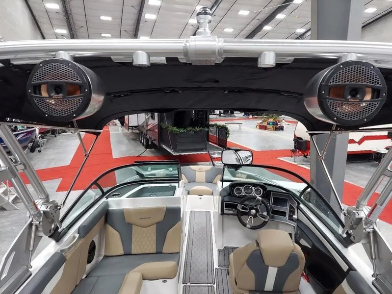 Slide: The Image of 2023 MasterCraft XT23 boat interior with modern dashboard and seating. - 17