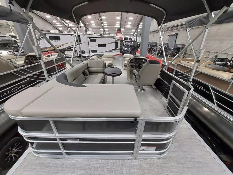 Slide: The Image of 2023 South Bay 220CR LE pontoon boat with spacious seating and modern design. - 12