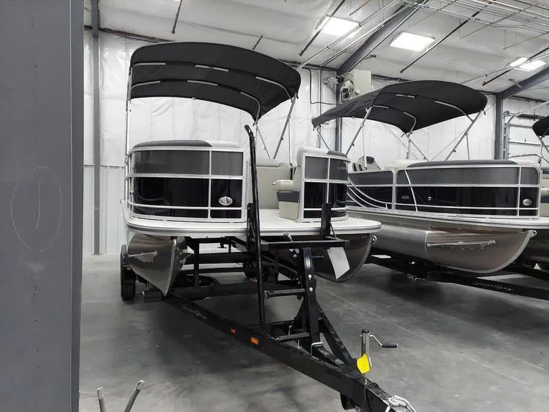 Slide: The Image of 2023 South Bay 220CR LE pontoon boat in a showroom. - 5