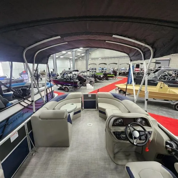 Slide: The Image of 2023 South Bay 224RS LE 25" pontoon boat interior at a boat show. - 10