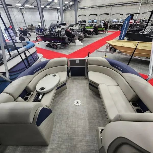 Slide: The Image of 2023 South Bay 224RS LE 25" pontoon boat interior at a boat show. - 11