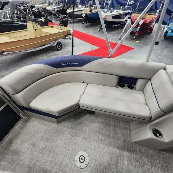 Slide: The Image of 2023 South Bay 224RS LE 25" pontoon boat interior with plush seating. - 14