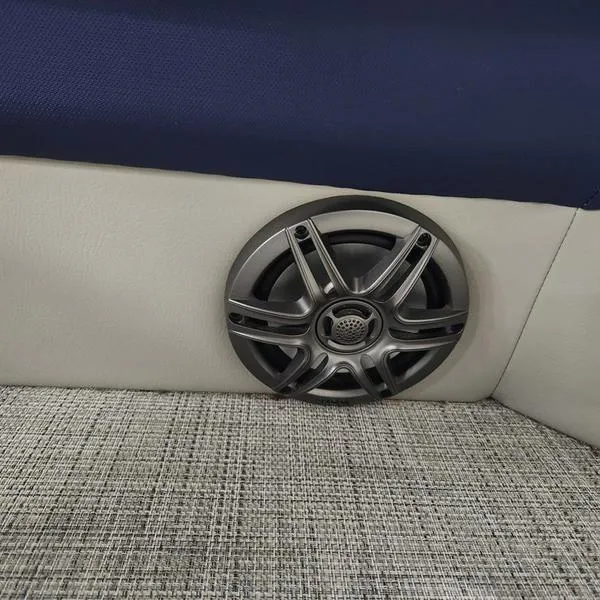 Slide: The Image of 2023 South Bay 224RS LE boat speaker on blue and gray interior. - 22