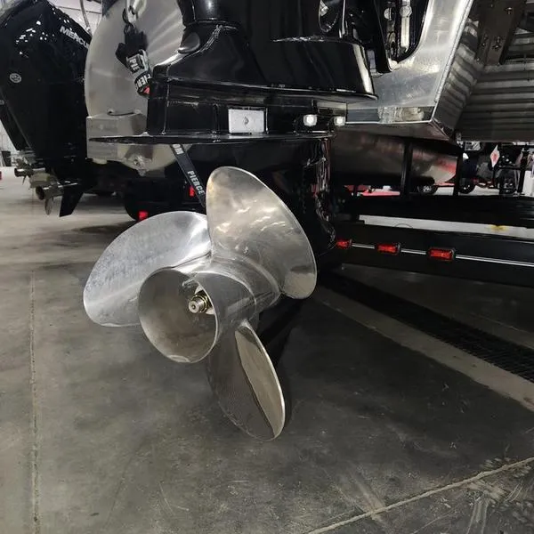 Slide: The Image of Close-up of a 2023 South Bay 224RS LE boat propeller in a garage setting. - 25
