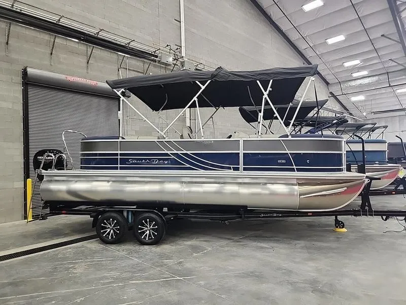 Slide: The Image of 2023 South Bay 224RS LE pontoon boat in a warehouse setting. - 3