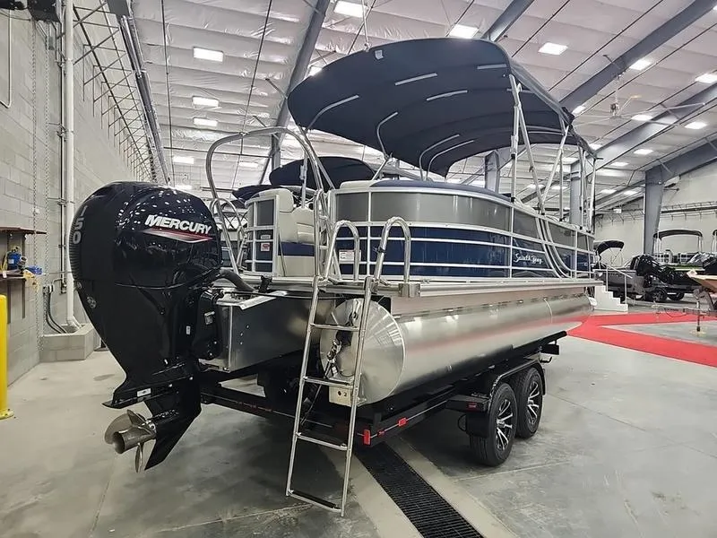 Slide: The Image of 2023 South Bay 224RS LE pontoon boat with Mercury engine in a showroom. - 4