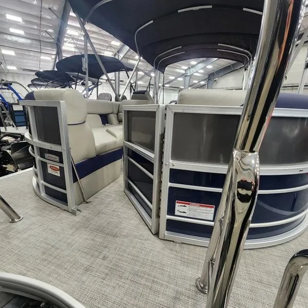 Slide: The Image of 2023 South Bay 224RS LE pontoon boat interior with seating and canopy. - 7