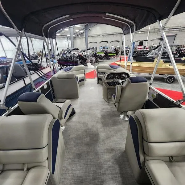 Slide: The Image of 2023 South Bay 224RS LE 25" pontoon boat interior with seating and steering console. - 9