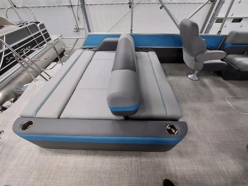 Slide: The Image of 2023 South Bay S224 UL 3.0 pontoon boat interior with gray and blue seating. - 10
