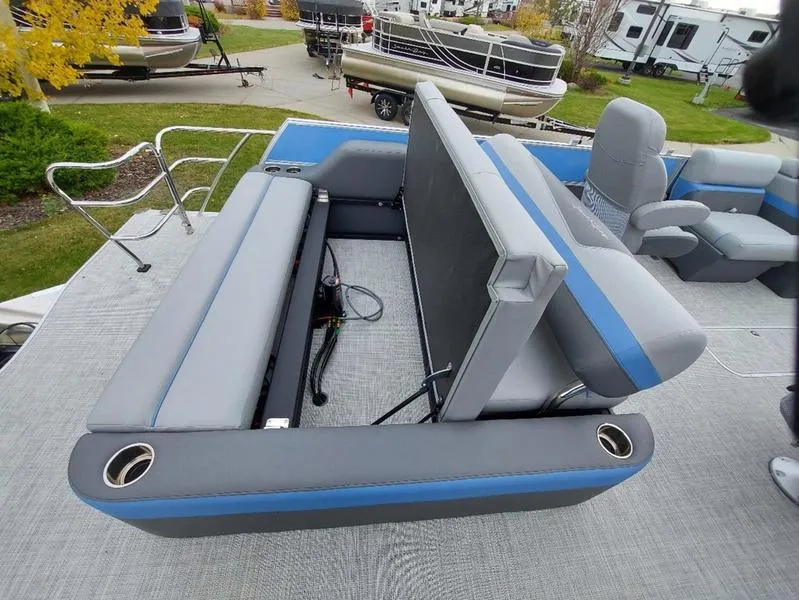 Slide: The Image of 2023 South Bay S224 UL 3.0 pontoon boat with adjustable seating and cup holders. - 14