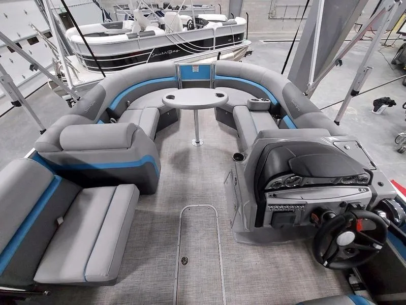 Slide: The Image of 2023 South Bay S224 UL 3.0 pontoon boat interior with seating and helm. - 18