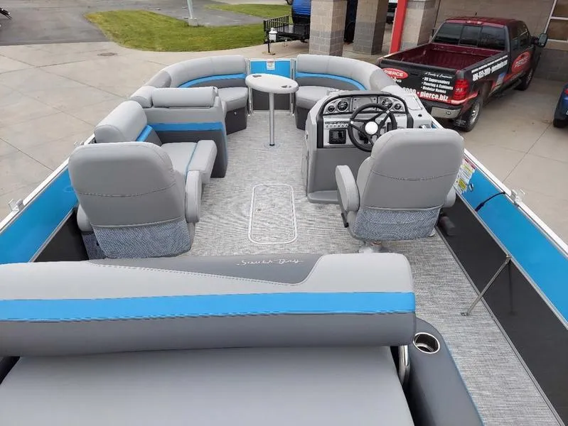 Slide: The Image of 2023 South Bay S224 UL 3.0 pontoon boat interior with gray and blue seating. - 19