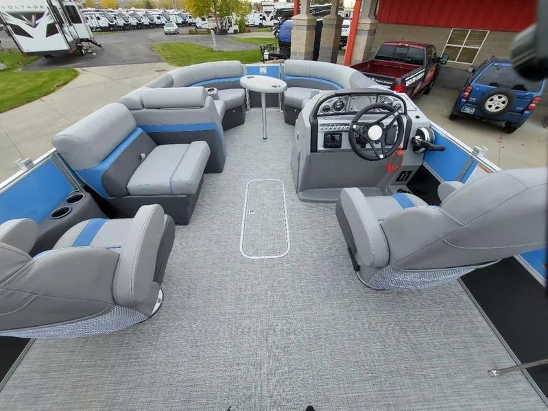Slide: The Image of 2023 South Bay S224 UL 3.0 pontoon boat interior with gray seating and steering console. - 20