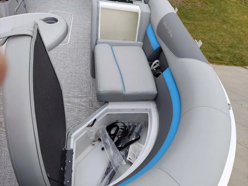 Slide: The Image of 2023 South Bay S224 UL 3.0 pontoon boat interior with open storage compartment. - 25