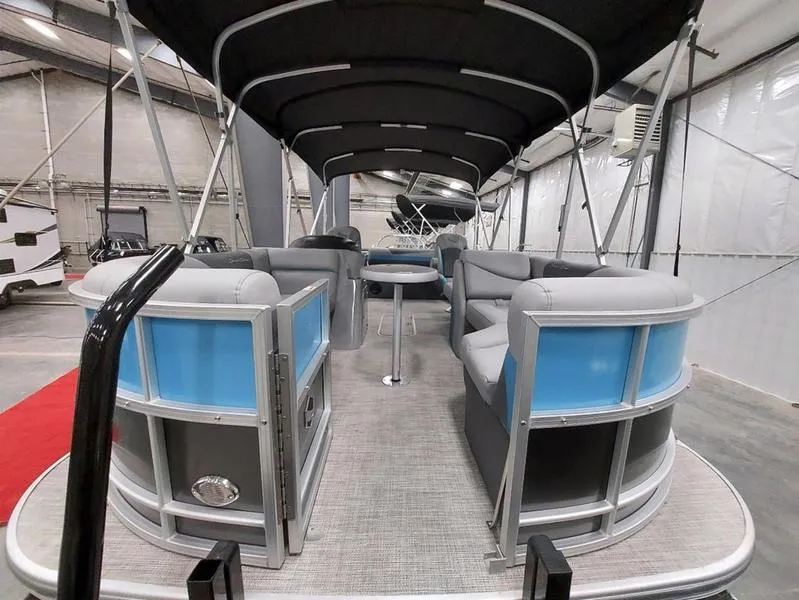 Slide: The Image of 2023 South Bay S224 UL 3.0 pontoon boat interior with seating and canopy. - 7