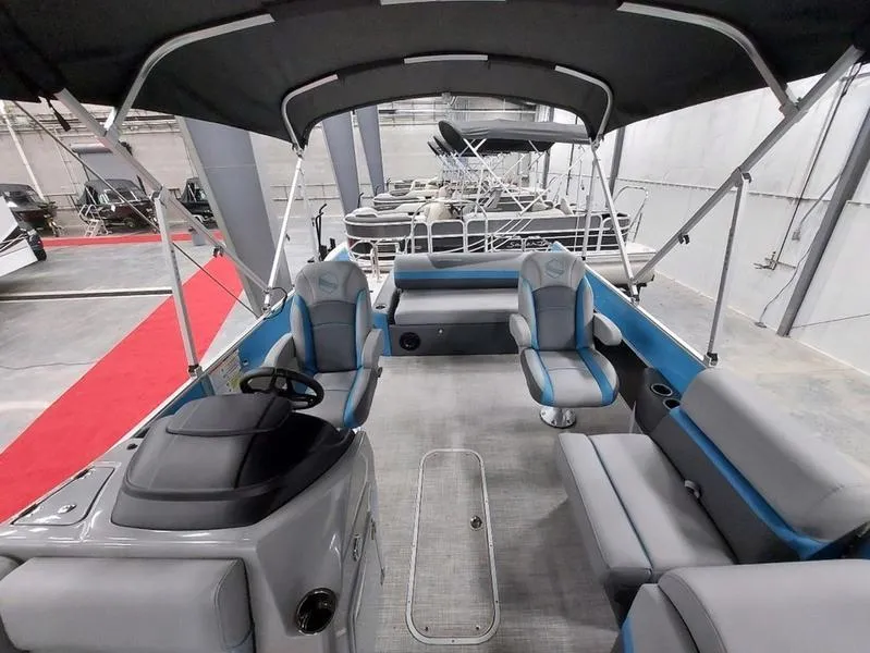 Slide: The Image of 2023 South Bay S224 UL 3.0 pontoon boat interior with seating and canopy. - 8