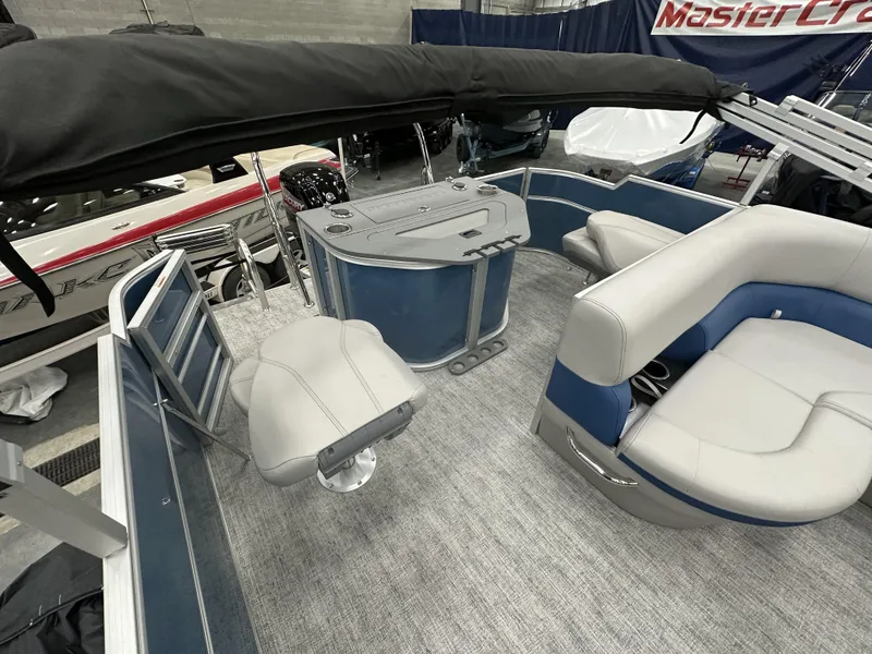 Slide: The Image of 2025 South Bay 222FCRLE pontoon boat interior with seating and helm station. - 10