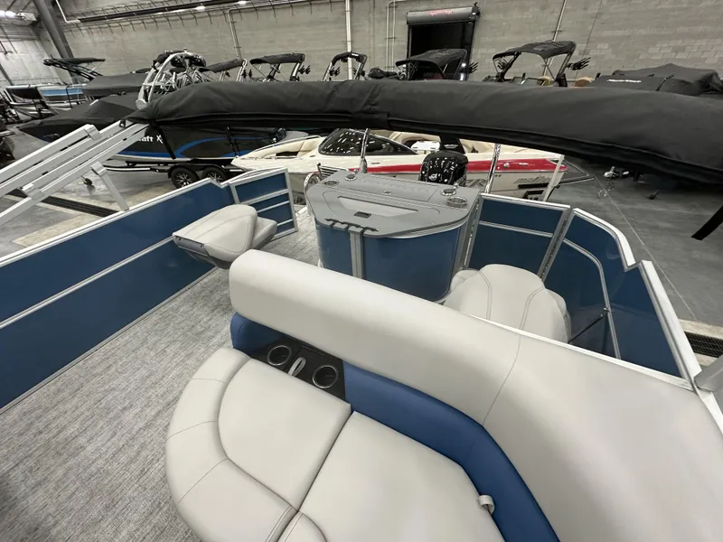Slide: The Image of 2025 South Bay 222FCRLE pontoon boat interior with plush seating and modern design. - 11