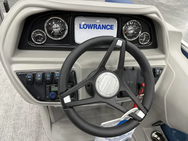 Slide: The Image of Steering console of 2025 South Bay 222FCRLE boat with Lowrance display and gauges. - 14