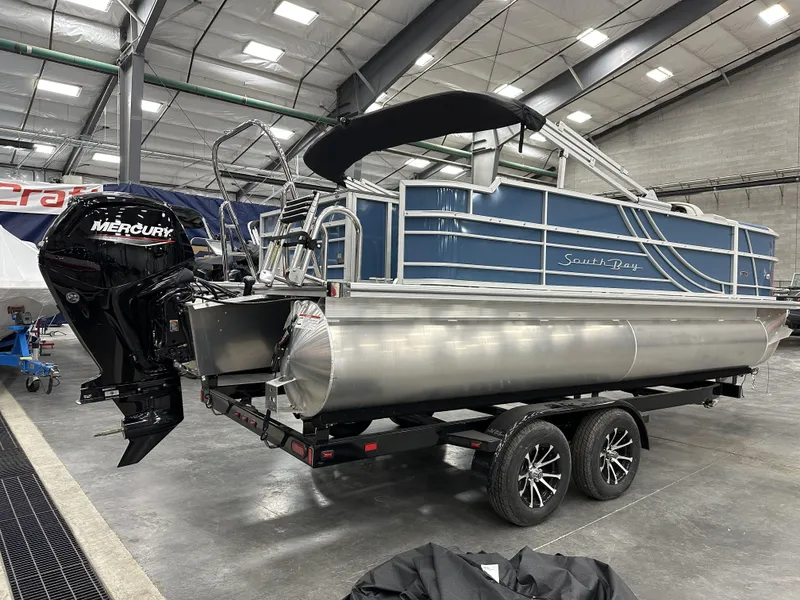 Slide: The Image of 2025 South Bay 222FCRLE pontoon boat with Mercury engine in showroom. - 4